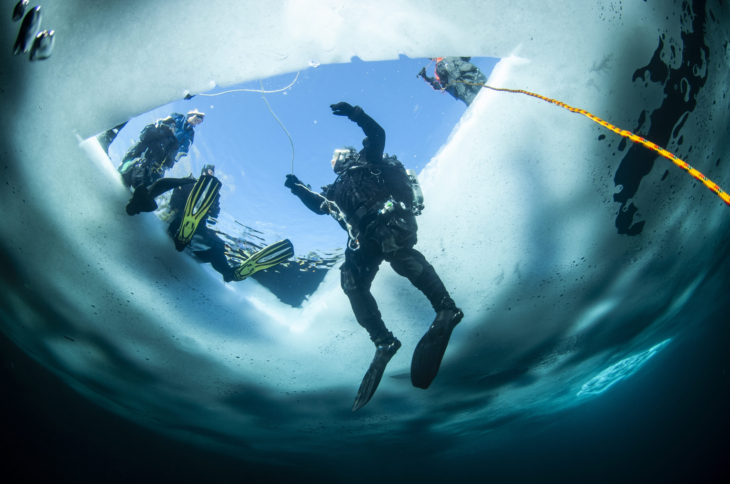 Winter Ice Diving Underwater In A Quarry In Canada By The Shore Scuba